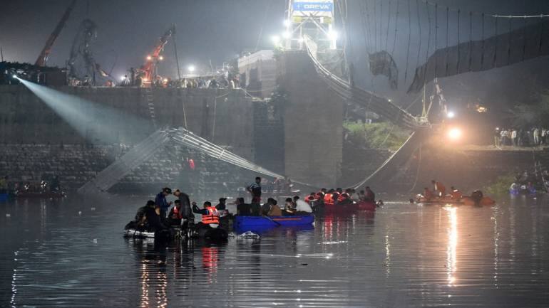 In Photos Rescuers Look For Survivors After Morbi Bridge Collapse