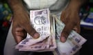 Yuan, rupee outlook sours on Fed interest rate hike bets: Poll