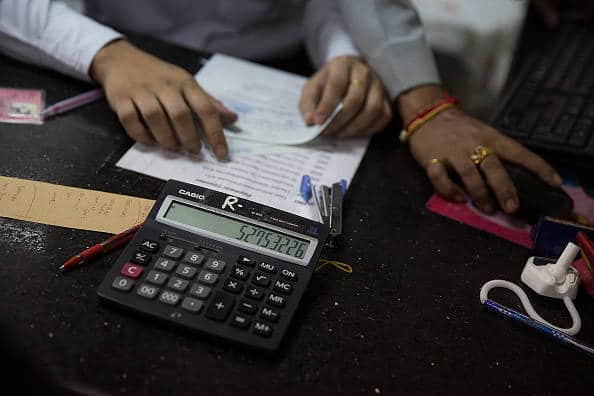 Manage your money | Keep and track of your expenditure, savings and investments. Knowing what you’re spending where and how much can help you plan your finances more efficiently and also help you track excesses or misses. Use tax laws to understand and navigate investment decisions. If needed, get professional help to maximise your income stream. (Image Source: Taylor Weidman/Getty Images)