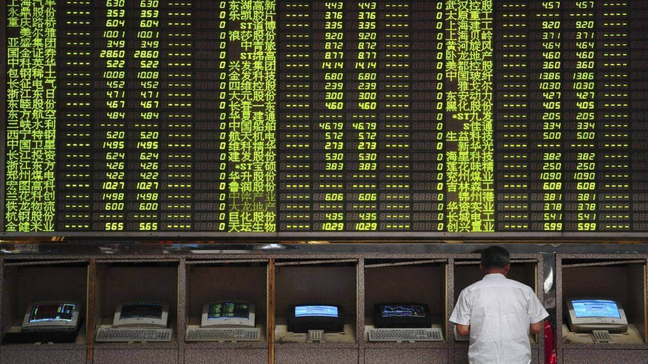 Asia shares dip on hawkish Fed remarks; commodities rise on China reopening