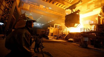A worker observes an electric arc furnace in a steel factory of Store Steel in Store, Slovenia November 17, 2016. REUTERS/Srdjan Zivulovic - RTX2U61W