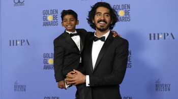 Actor Dev Patel holds actor Sunny Pawar, who portrays the same character as Patel in the movie "Lion", as they pose together backstage during the 74th Annual Golden Globe Awards in Beverly Hills, California, U.S., January 8, 2017. REUTERS/Mario Anzuoni - RTX2Y16M