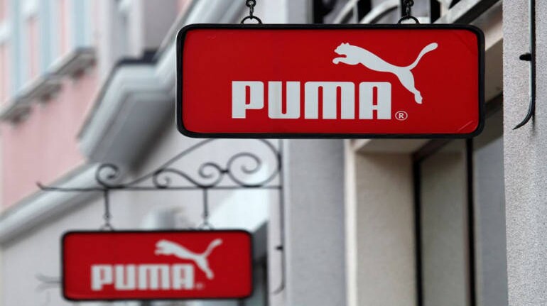 puma brand logo, a sign above the entrance to the company's brand