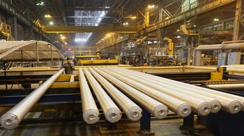 An employee works with cylindrical 6-metre aluminium ingots at the Rusal Sayanogorsk aluminium smelter outside the Siberian town of Sayanogorsk, Russia, March 15, 2017. Picture taken March 15, 2017. REUTERS/Ilya Naymushin - RTX3197L