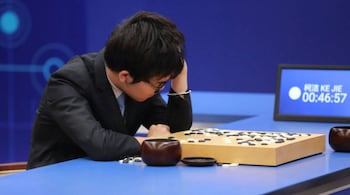 Chinese Go player Ke Jie reacts during his second match against Google's artificial intelligence program AlphaGo at the Future of Go Summit in Wuzhen, Zhejiang province, China May 25, 2017. REUTERS/Stringer ATTENTION EDITORS - THIS IMAGE WAS PROVIDED BY A THIRD PARTY. EDITORIAL USE ONLY. CHINA OUT. - RTX37IUK