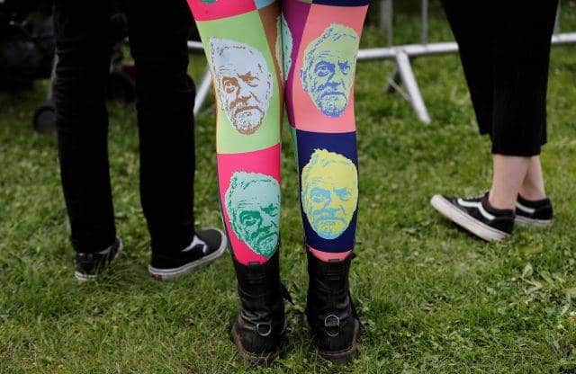 A woman wears tights showing the face of Jeremy Corbyn, leader of Britain's opposition Labour Party, at a campaign rally in Birmingham, Britain June 6, 2017. REUTERS/Darren Staples TPX IMAGES OF THE DAY - RTX39BV0