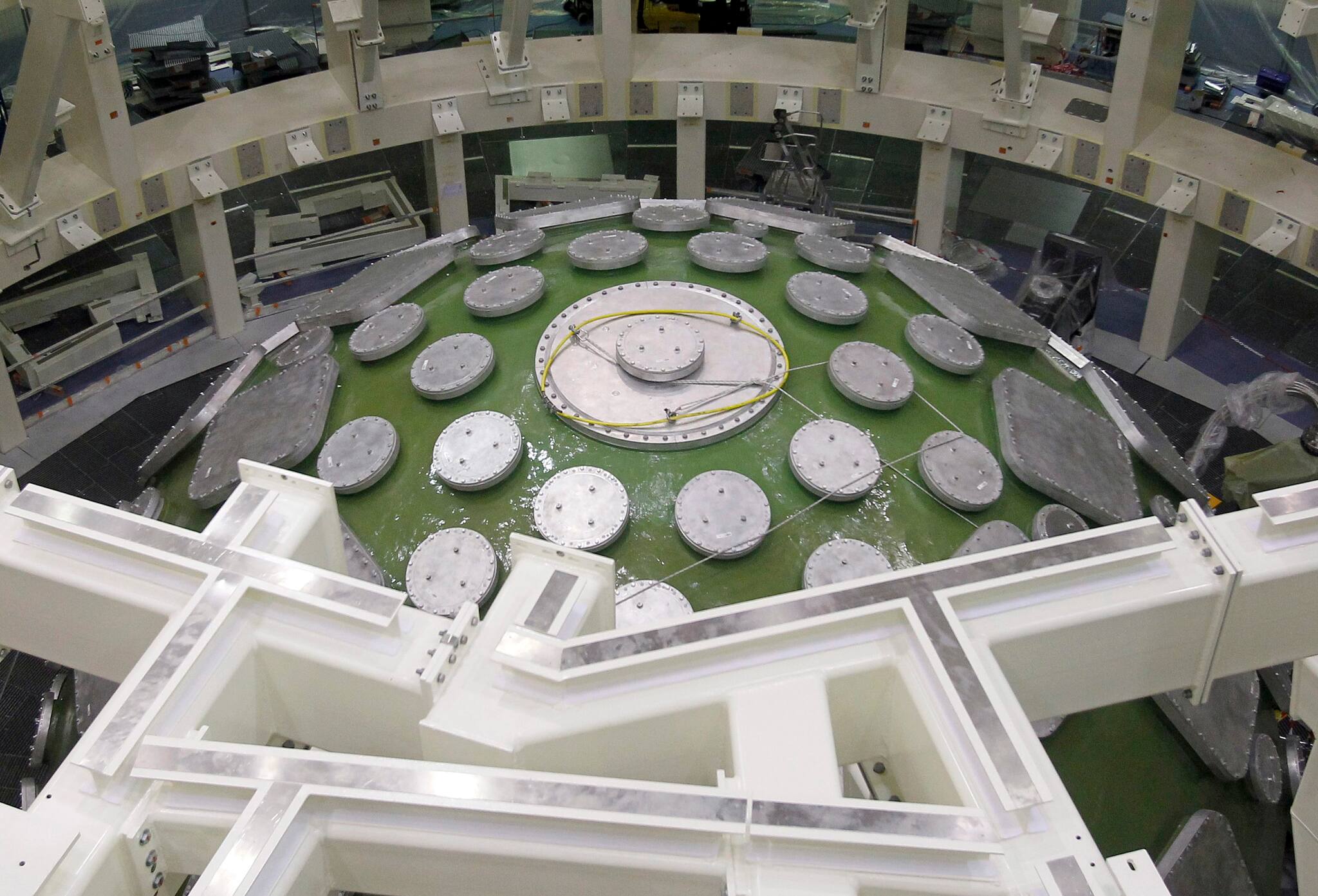 General view from above the 140-ton aluminium sphere covered with metal plates, measuring 10 metres in diameter and is 10 centimetres thick, at the Megajoule Laser project, currently under construction at the CESTA (Centre d'Etudes Scientifiques et Techniques d'Aquitaine) in Le Barp southwestern France, July 27, 2010. Scientists will be able to simulate nuclear tests using amplified energy from 176 lasers which is directed at a target located inside the sphere, thus reproducing nuclear fusion under temperature conditions some 100 times higher than those found at the centre of the sun. REUTERS/Regis Duvignau (FRANCE - Tags: ENERGY SCI TECH) - RTR2GRX5