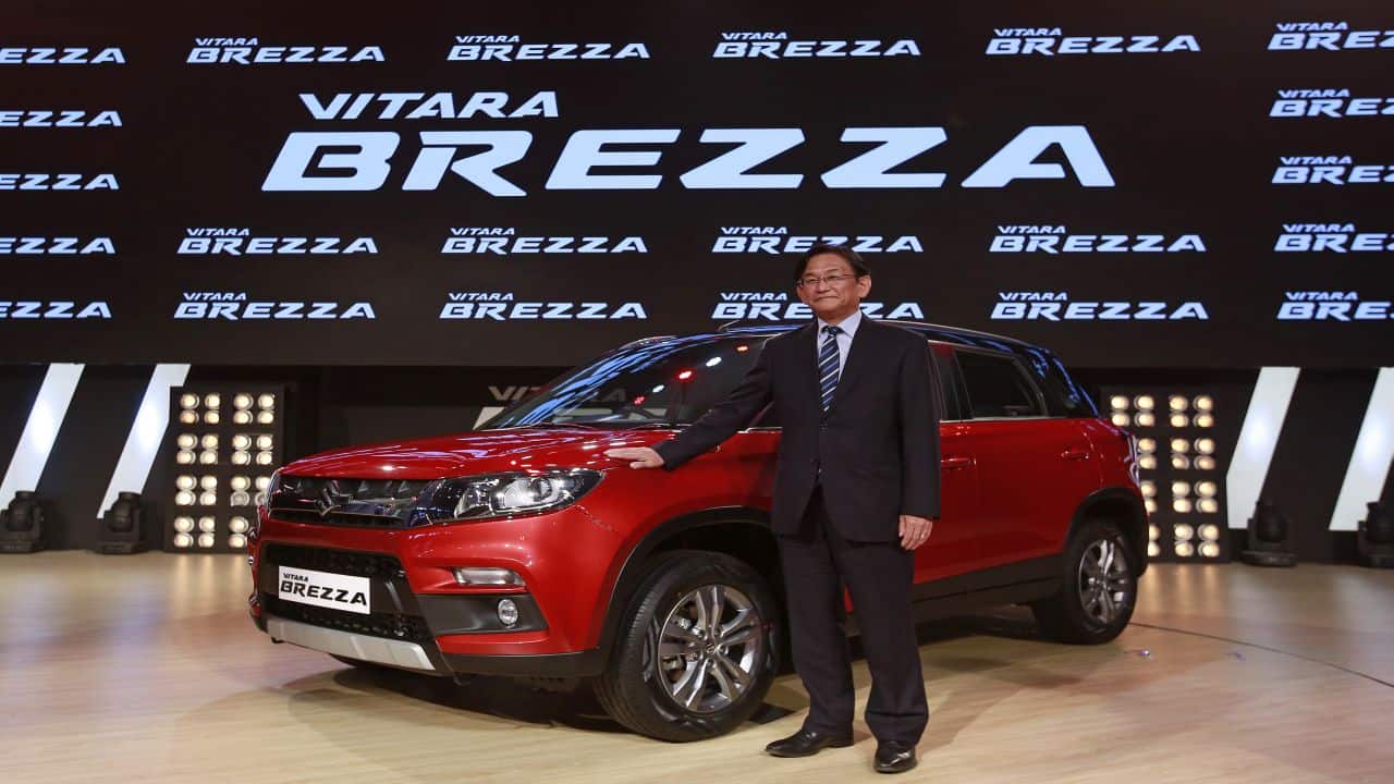 Kenichi Ayukawa, Managing Director and CEO of Maruti Suzuki India Ltd., poses with the newly launched Vitara Brezza car in Mumbai, India, March 8, 2016. REUTERS/Danish Siddiqui - RTS9TEY