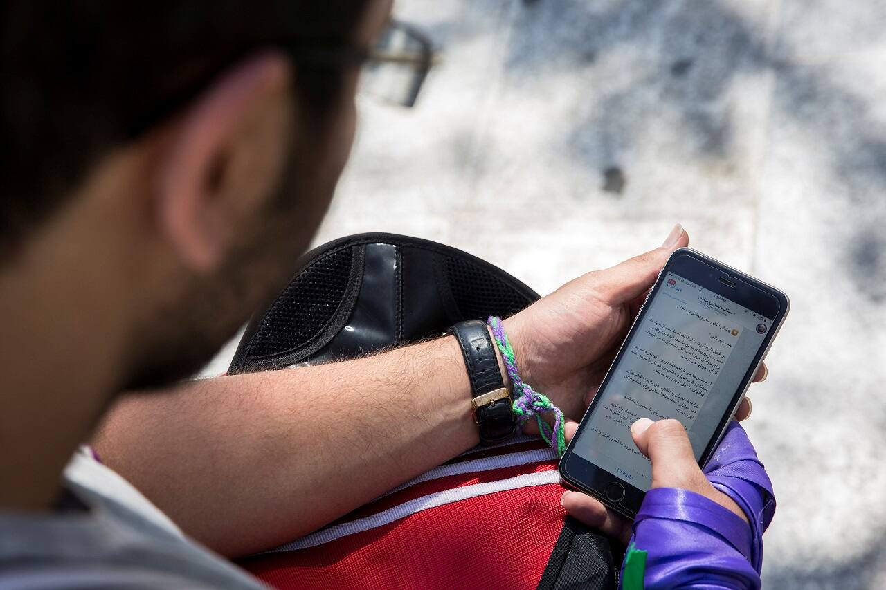 A man uses his smartphone to follow election news in Tehran, Iran May 17, 2017. REUTERS/TIMA ATTENTION EDITORS - THIS IMAGE WAS PROVIDED BY A THIRD PARTY. FOR EDITORIAL USE ONLY. - RTX36885