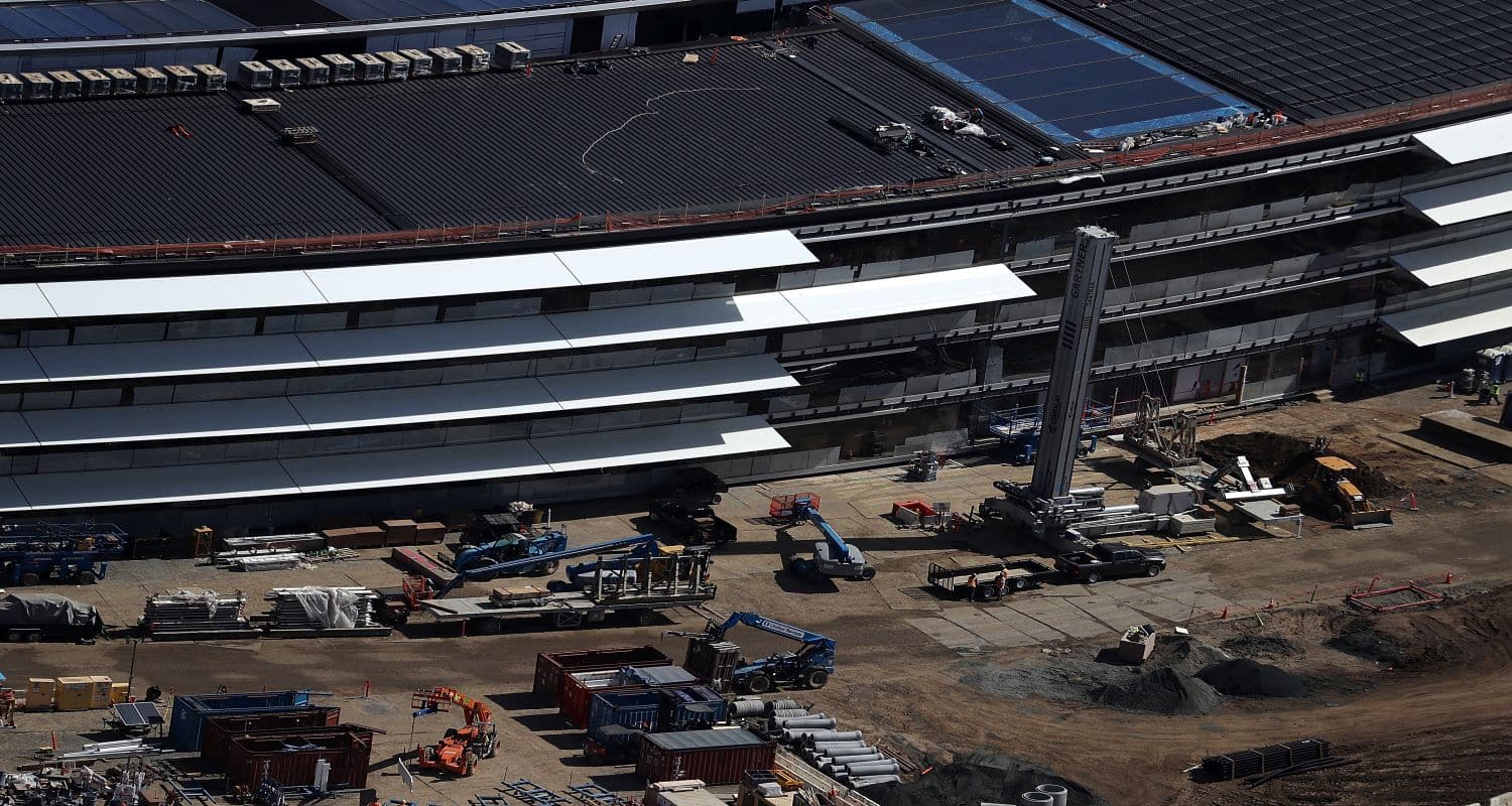 CUPERTINO, CA - APRIL 28: An aerial view of the new Apple headquarters on April 28, 2017 in Cupertino, California. Apple's new 175-acre 'spaceship' campus dubbed "Apple Park" is nearing completion and is set to begin moving in Apple employees. The new headquarters, designed by Lord Norman Foster and costing roughly $5 billion, will house 13,000 employees in over 2.8 million square feet of office space and will have nearly 80 acres of parking to accommodate 11,000 cars. (Photo by Justin Sullivan/Getty Images)
