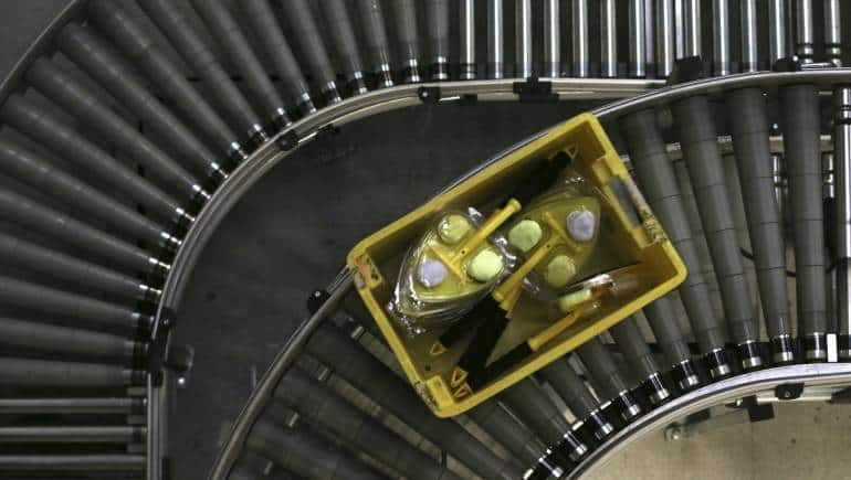 Stock travels on a conveyor belt during Black Friday deals week at an Amazon Fulfilment Centre