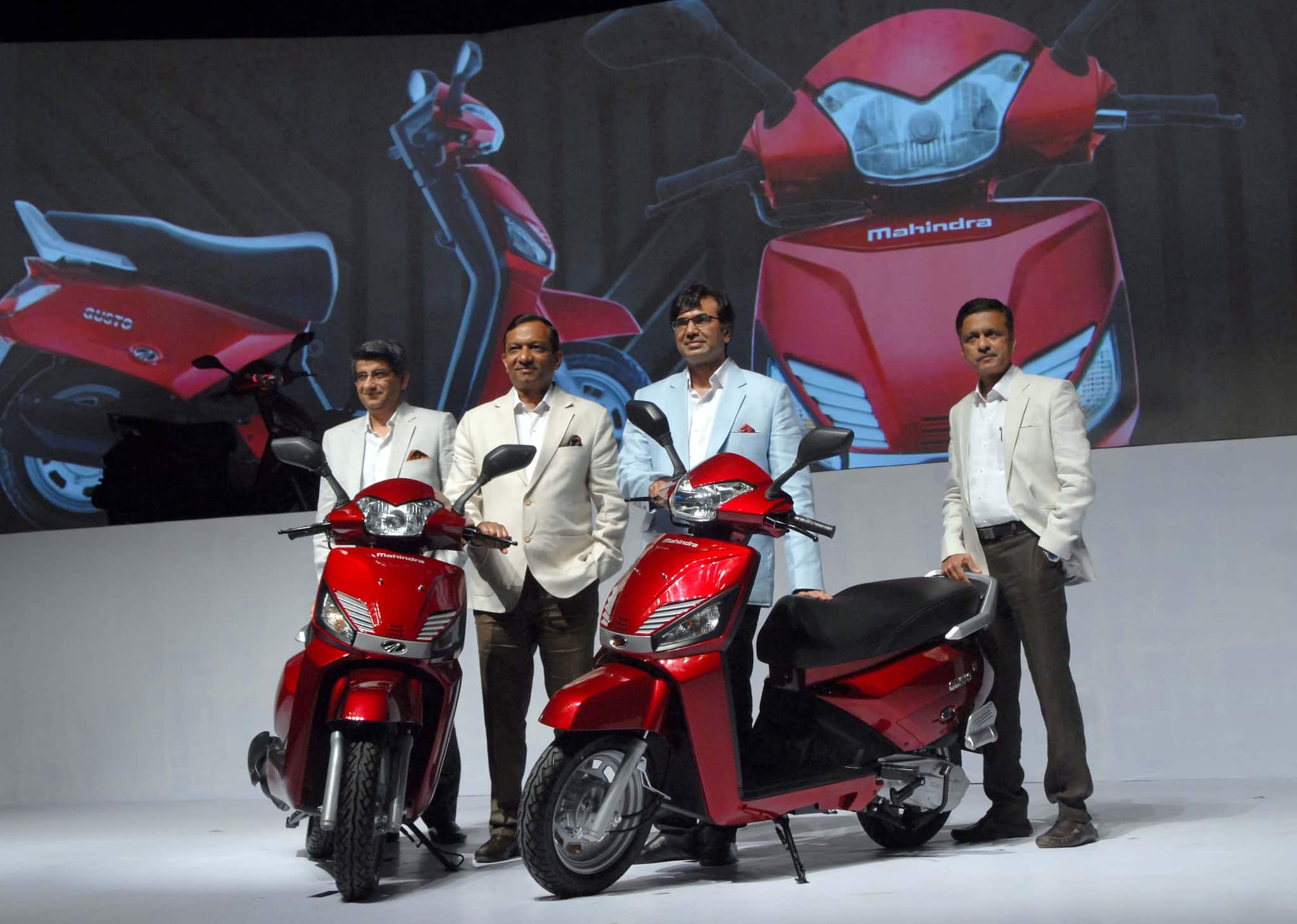 CAPTION - 4 ---- L to R - Viren Popli, Senior VP Strategy and Market Development, Mahindra 2 Wheelers, Pawan Goenka, ED, M&M, Rajesh Jejurikar, Chief Executive - Fram Equipment & Two Wheeler Division & Member of the Group Executive Board and PS Ashok, Head (R&D), Mahindra 2 Wheelersat the Mahindra Launches all new global Scooter GUSTO in Mumbai on 29th Sept, 2014- KAMLESH PEDNEKAR.