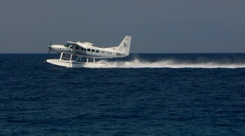 A seaplane takes off from the Amanwana resort on Moyo island in eastern Indonesia September 20, 2012. The seaplane taxiing over a coral reef to deliver tourists to a remote luxury resort may soon become a more familiar sight in Indonesia, an archipelago of 17,000 islands and only 183 airports. At the moment, seaplanes in Indonesia are limited to niche charter flights for high-end tourism and mining, but their use could spread to serve the needs of a fast-growing economy and to beat the lack of transport infrastructure. Picture taken September 20,2012.  REUTERS/Neil Chatterjee  (INDONESIA - Tags: TRANSPORT BUSINESS TRAVEL) - GM1E8A90DKC01