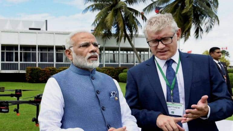 PM Modi visits IRRI, contributes two Indian rice seed varieties to its ...