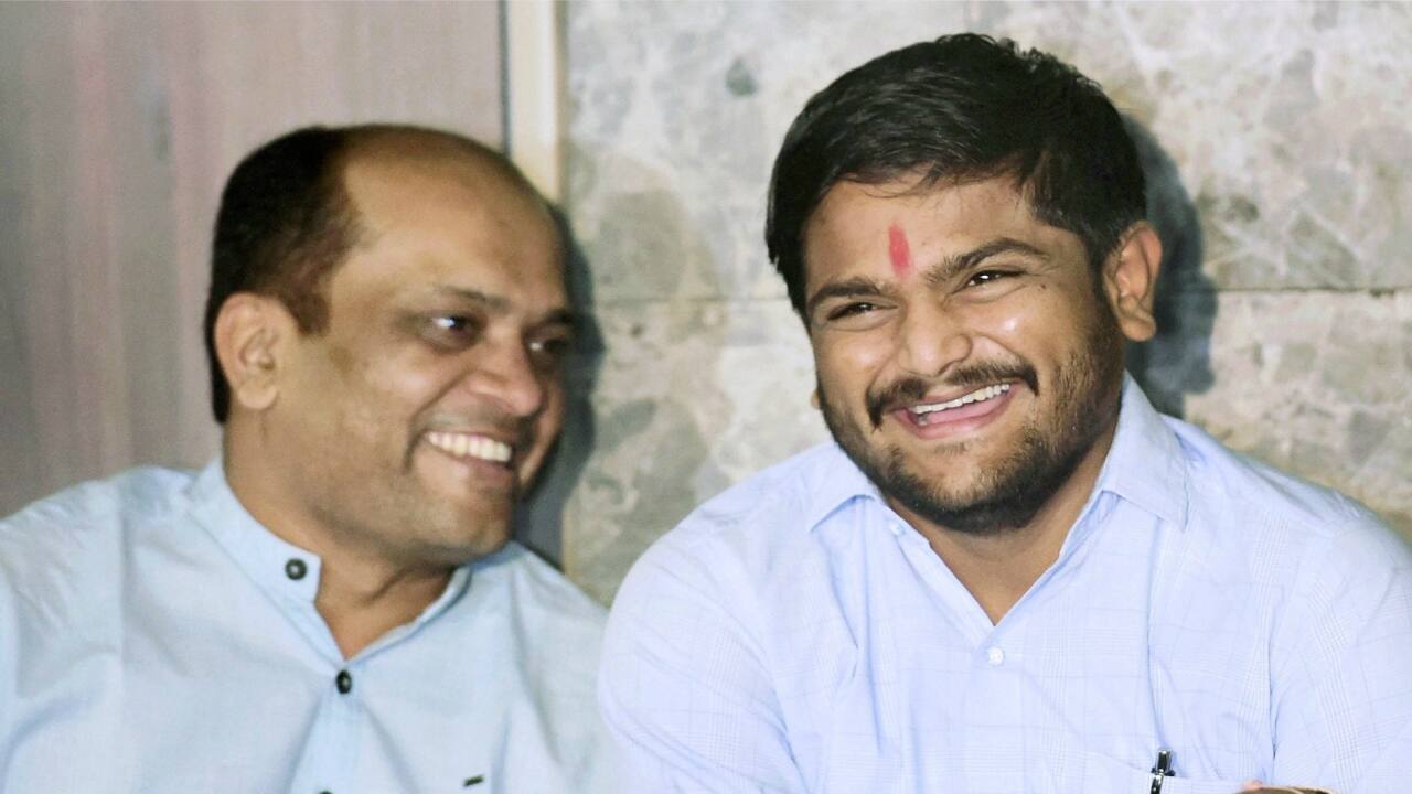 Patidar Anamat Andolan Samiti (PAAS) leader Hardik Patel with Dinesh Bhambaniya during a press conference in Ahmedabad. (PTI) 