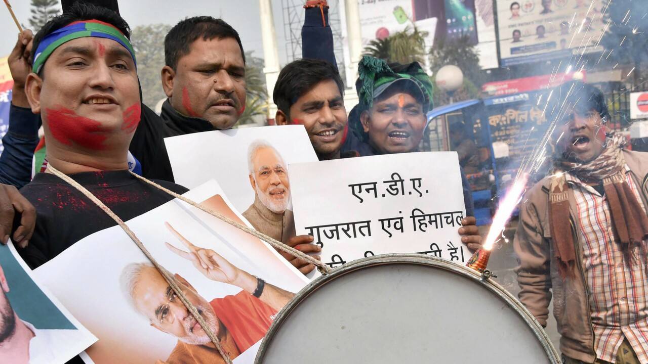 NDA supporters celebrate success in the Gujarat and Himachal Pradesh Assembly elections 2017, in Patna on Monday. (PTI)
