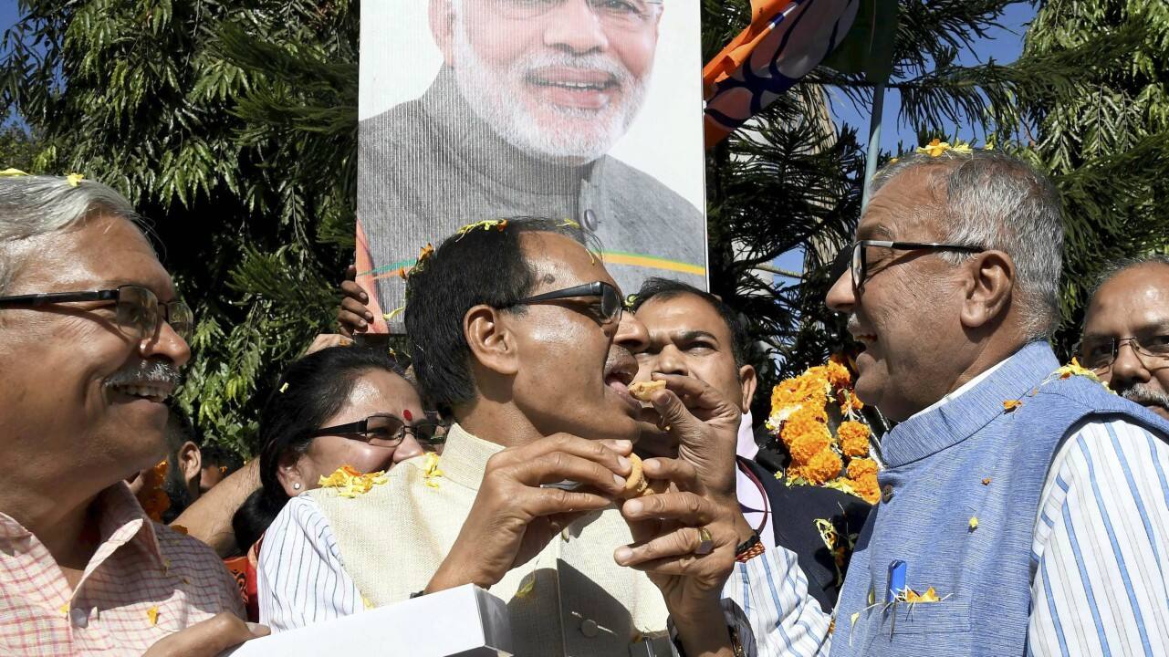  Madhya Pradesh Chief Minister Shivraj Singh Chouhan with state BJP president Nandkumar Singh Chouhan celebrating BJP’s success in Gujarat and Himachal Pradesh State assembly elections, in Bhopal on Monday. (PTI) 