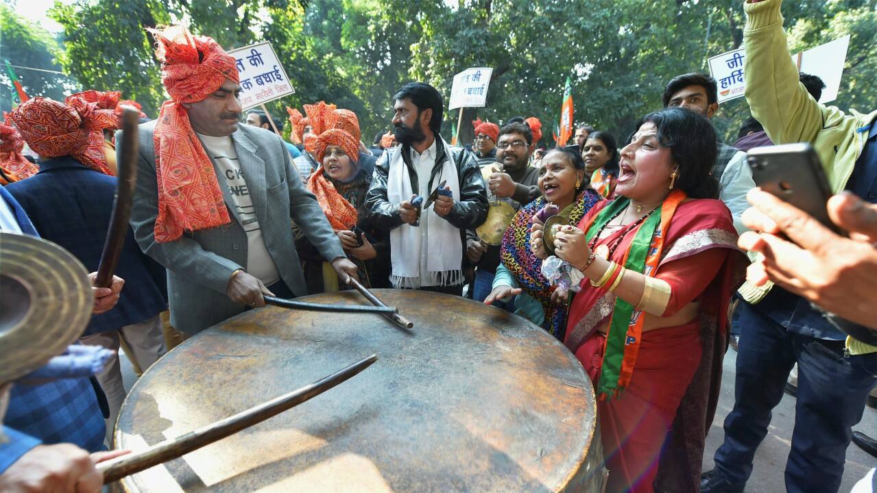 Party workers and supporters celebrating BJP’s success in Gujarat and Himachal Pradesh State assembly election outside the BJP headquarte, in New Delhi on Monday. (PTI)