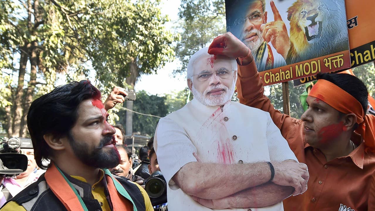 Party workers and supporters celebrating BJP's success in the Gujarat and Himachal Pradesh state assembly elections outside the BJP headquarter, in New Delhi on Monday. (PTI)