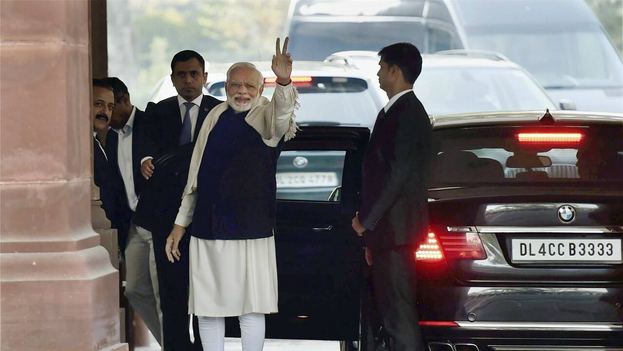  Prime Minister Narendra Modi flashes victory sign after BJP’s success in Himachal and Gujarat assembly elections, on his arrival for the winter session of Parliament, in New Delhi on Monday. (PTI) 