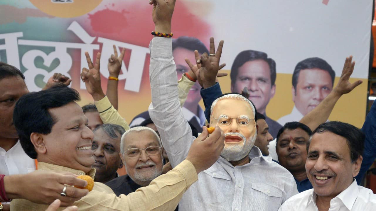  BJP workers dance as they celebrate the party's win in the Gujarat and Himachal Pradesh Assembly elections, in Mumbai on Monday. (PTI) 