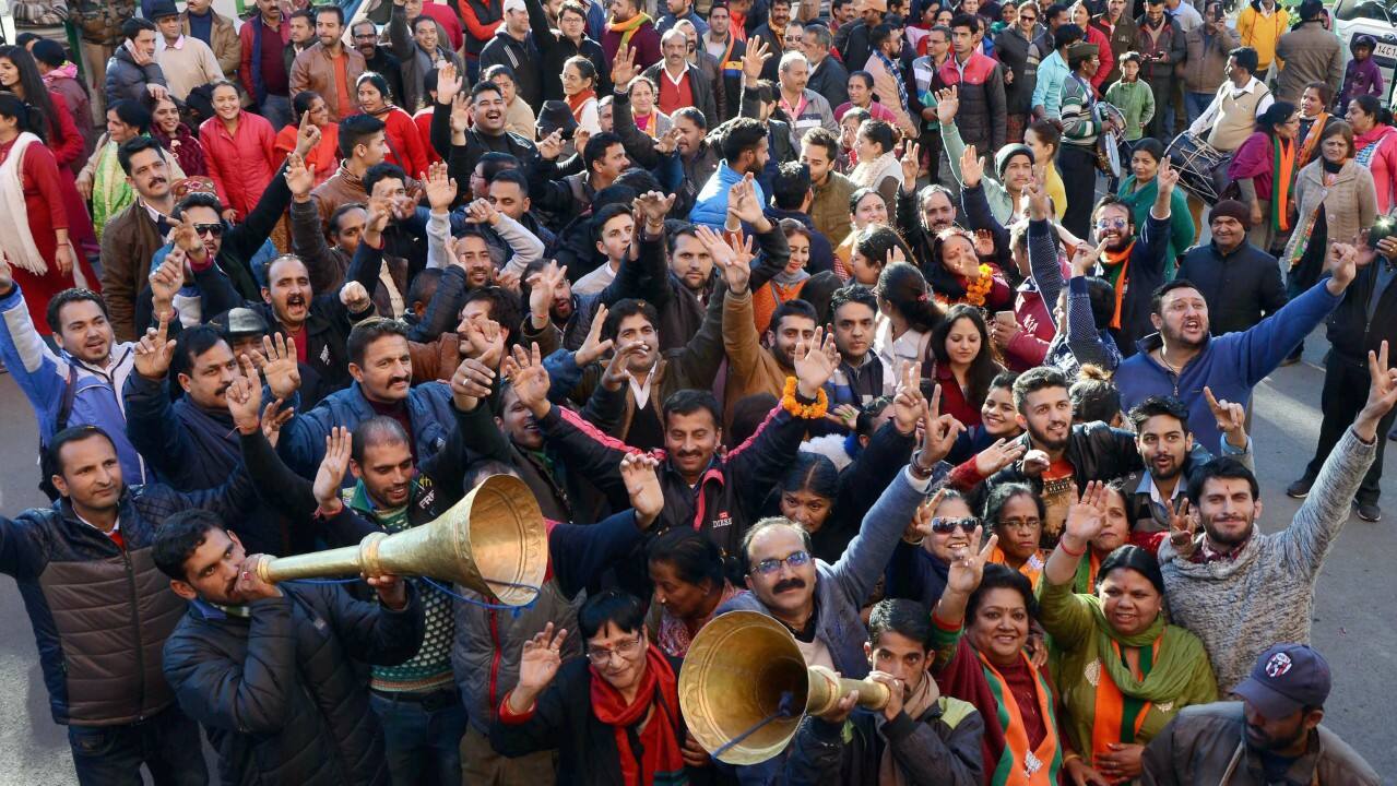 BJP supporters celebrate party’s victory in the Himachal Pradesh Assembly elections, in Shimla on Monday. (PTI) 