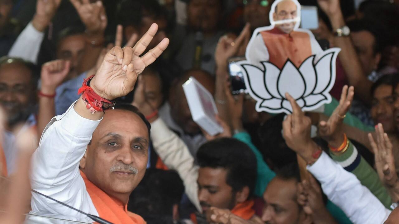 Gujarat Chief Minister Vijay Rupany shows victory sign as he arrives to participate in the celebrations after BJP's win in the State Assembly elections, at the party office 'Kamlam' in Gandhinagar on Monday. (PTI) 