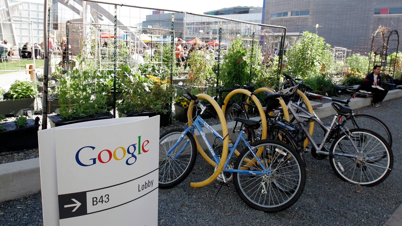 Employees use community bikes to travel around Google headquarters in Mountain View, California March 3, 2008. REUTERS/Erin Siegal (UNITED STATES) - GM1E4340VIW01