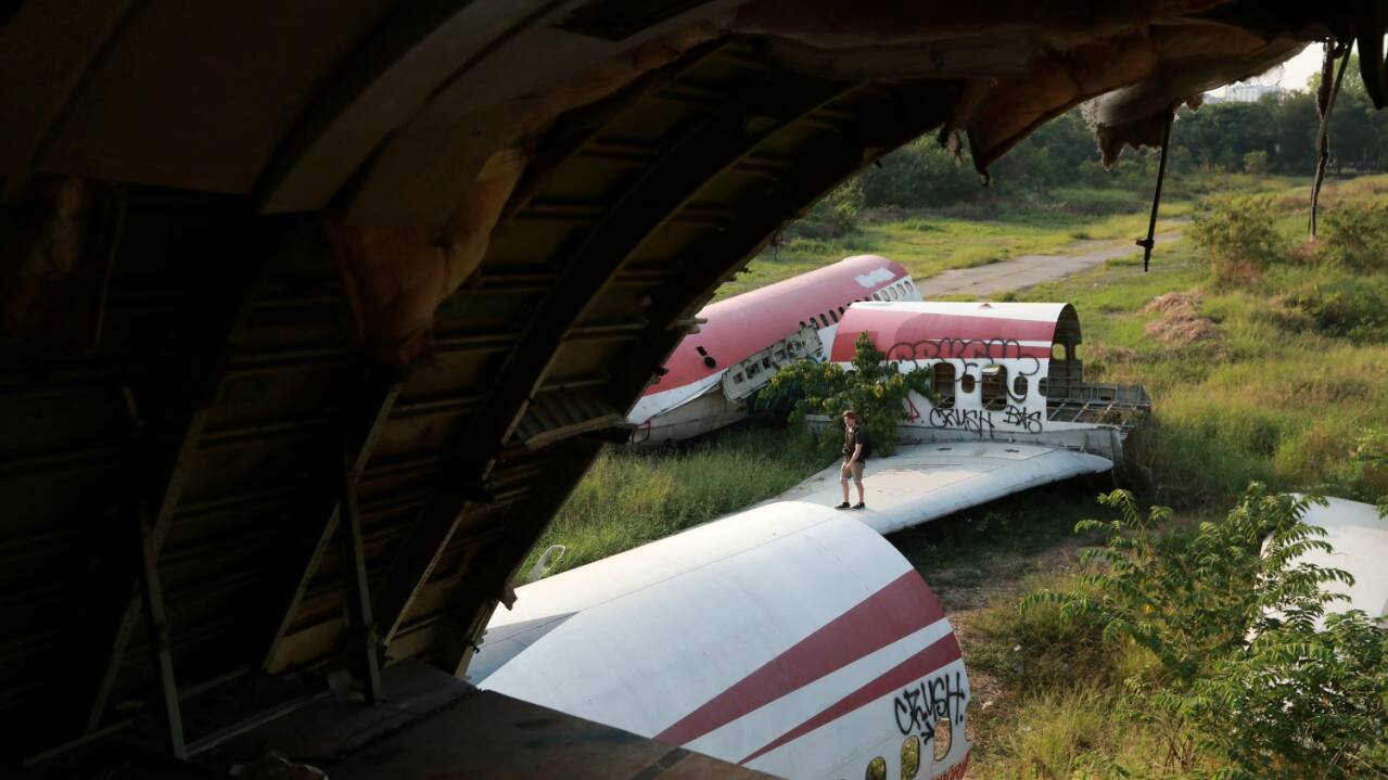 These planes are usually stripped of their interiors, but their outlining structure and frames are kept intact, along with the carpeting, overhead bins and bathrooms. All over the damaged plane are oxygen masks, safety manuals and debris scattered carelessly. (REUTERS)