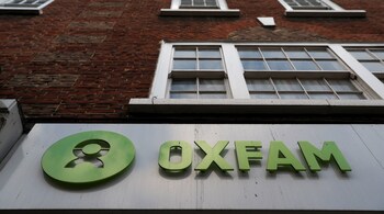 A sign is seen above a branch of Oxfam, in London, Britain February 12, 2018. REUTERS/Peter Nicholls - RC133C18EF20
