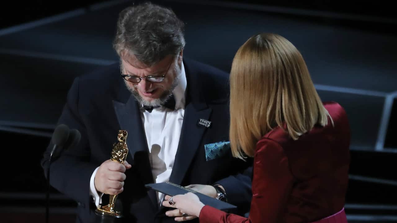 Guillermo del Toro accepts the Oscar for Best Director for "The Shape of Water" from presenter Emma Stone (R). (Reuters) Guillermo del Toro accepts the Oscar for Best Director for "The Shape of Water" from presenter Emma Stone (R). (Reuters)