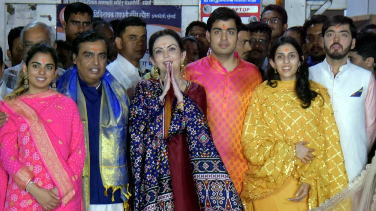 The Ambani family during their visit to Mumbai's Siddhivinayak Temple on Sunday after an engagement ceremony of billionaire Mukesh Ambani's eldest son Akash Ambani to Shloka Mehta in Goa. Shloka is the daughter of prominent diamantaire Russell Mehta. The newly engaged couple are reported to be married later this year. (PTI) The Ambani family during their visit to Mumbai's Siddhivinayak Temple on Sunday after an engagement ceremony of billionaire Mukesh Ambani's eldest son Akash Ambani to Shloka Mehta in Goa. Shloka is the daughter of prominent diamantaire Russell Mehta. The newly engaged couple are reported to be married later this year. (PTI)