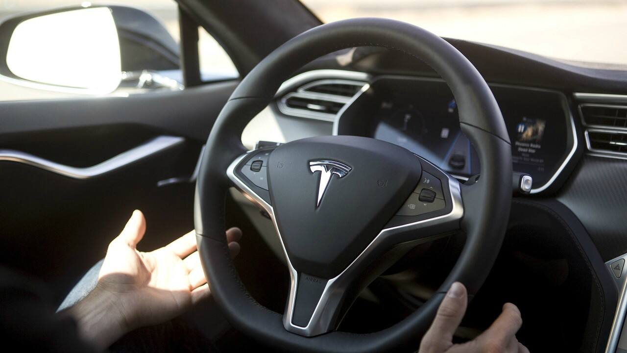Elon Musk-led Tesla is working on ‘Tesla Autopilot’, a system that can be adopted in Tesla vehicles. The company claims that the system allows cars to seek speed assistance, can auto park, auto steer and has adaptive cruise control. (Image: Reuters)