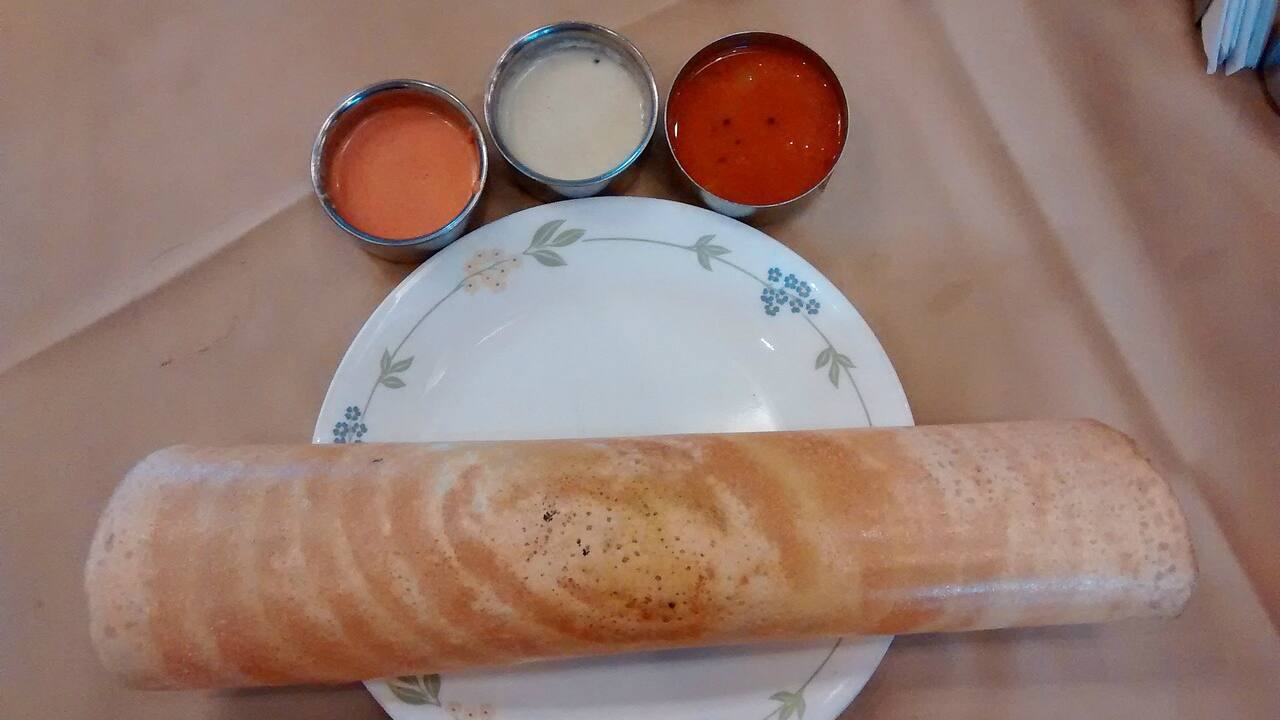 Ans. Dosa. A student asked him the following question: “In real life, I have a query on Dosa prices -- when inflation rates go up, Dosa prices go up, but when inflation rates are lower, the Dosa prices are not lowered. What is happening to our beloved Dosa, sir? ”He replied: “The technology for making dosas hasn’t actually changed. Till today that person puts the batter on the tawa, spreads it around and then takes it out, right? There has been no technological improvement there. “However, the wages that you are paying to that gentleman, especially in a high-wage sort of state like Kerala, are going up all the time”.