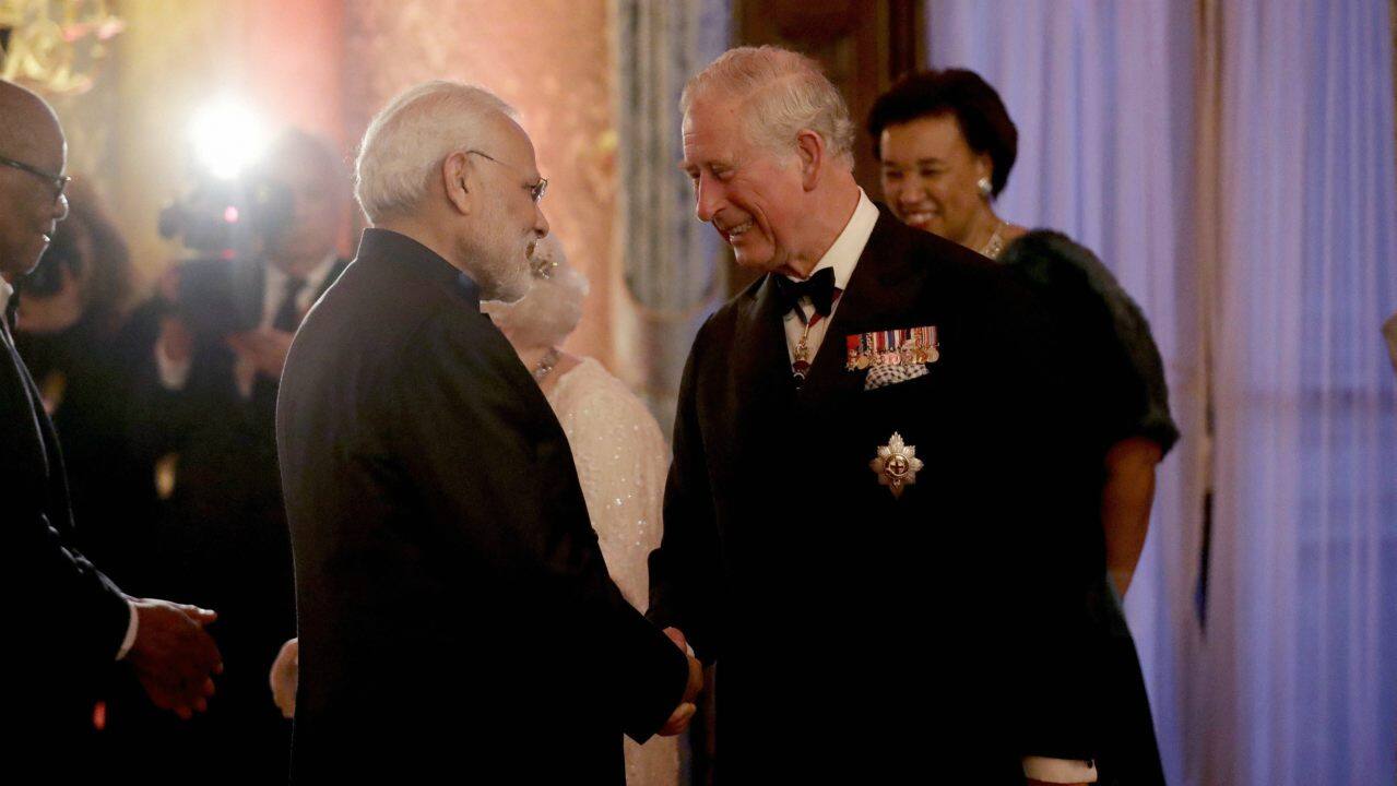 Britain's Prince Charles, right, greets India's Prime Narendra Modi in a receiving line for the Queen's Dinner for the Commonwealth Heads of Government Meeting (CHOGM) at Buckingham Palace in London. (Image: AP/PTI)