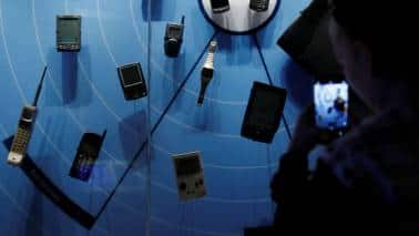 Q6. The world's first in this category of products from the world of technology was called a Dynatac. It was 30 ounces in weight, 10 inches high and featured a "Whip Antenna". What is being described? (Image: Reuters) Q6. The world's first in this category of products from the world of technology was called a Dynatac. It was 30 ounces in weight, 10 inches high and featured a "Whip Antenna". What is being described? (Image: Reuters)