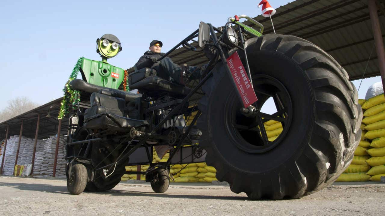 Monster truck -- Zhang Yali, 49, made this giant bicycle with his friends. It is 3.2-metre-high and 5.5-metre-long and seats three people. It weighs over one tonne, cost Zhang more over 20,000 yuan (USD 3,156 ). Zhang spent two months making this bike as a gift for his son. (REUTERS)