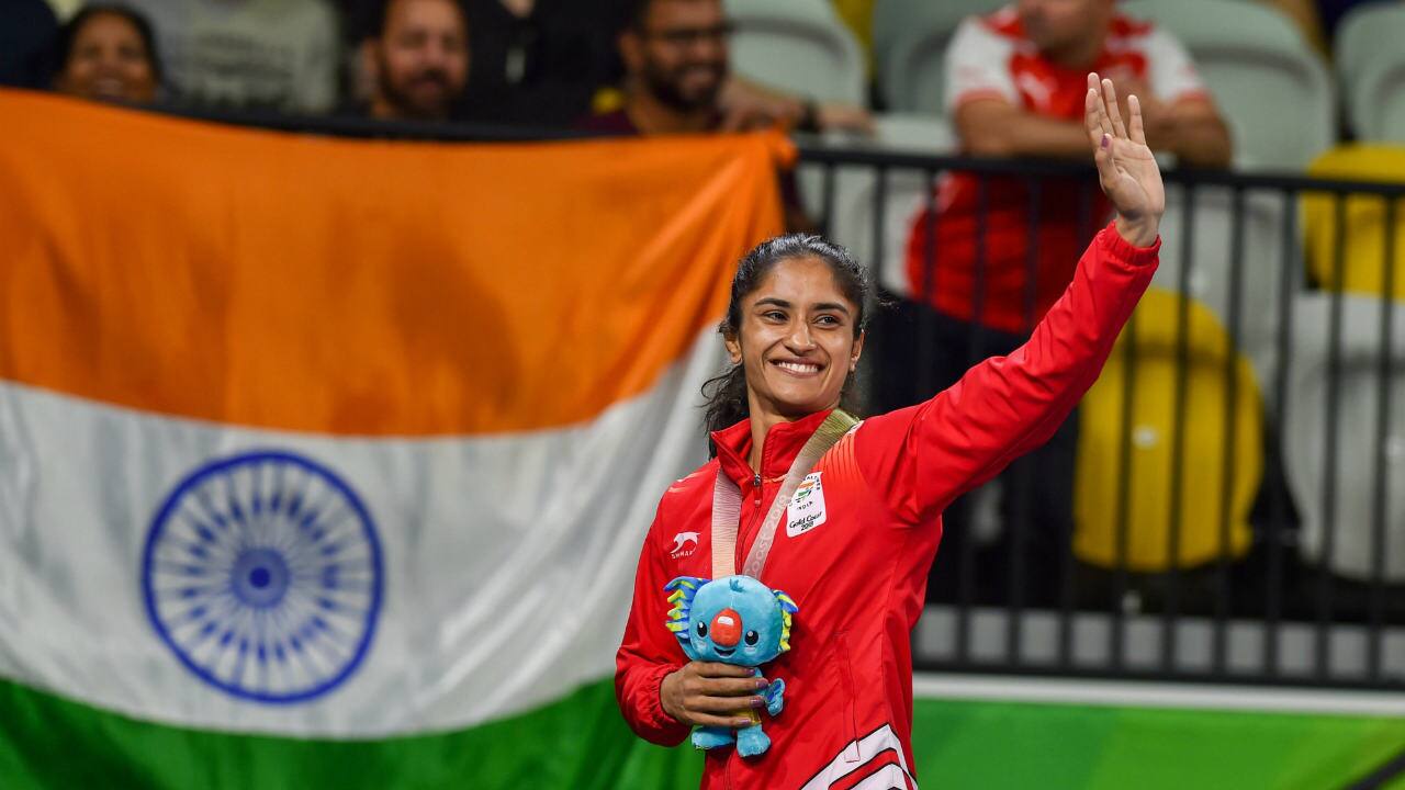 Vinesh Phogat | Phogat waves during the medal ceremony of Women’s 50kg wrestling Nordic in Gold Coast, on Saturday. (Image: PTI)