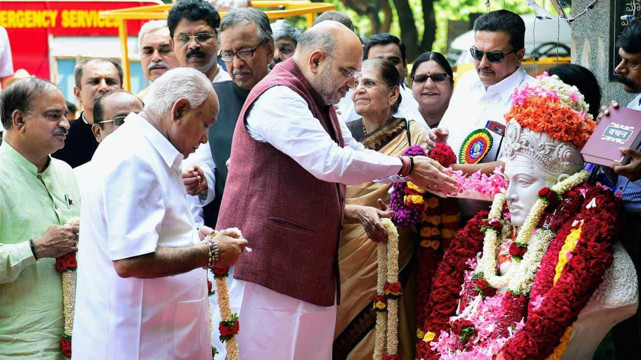 BJP National President Amit Shah offers tribute to Lord Basaveshwara on the occasion of Basava Jayanti in Bengaluru on 18th April 2018. (PTI Photo) BJP National President Amit Shah offers tribute to Lord Basaveshwara on the occasion of Basava Jayanti in Bengaluru on 18th April 2018. (PTI Photo)