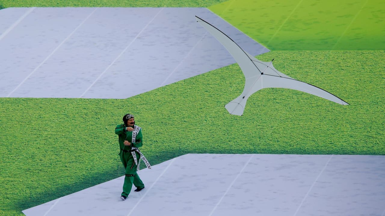 A performer flies a bird shaped kite during the opening ceremony. (Image: Reuters)