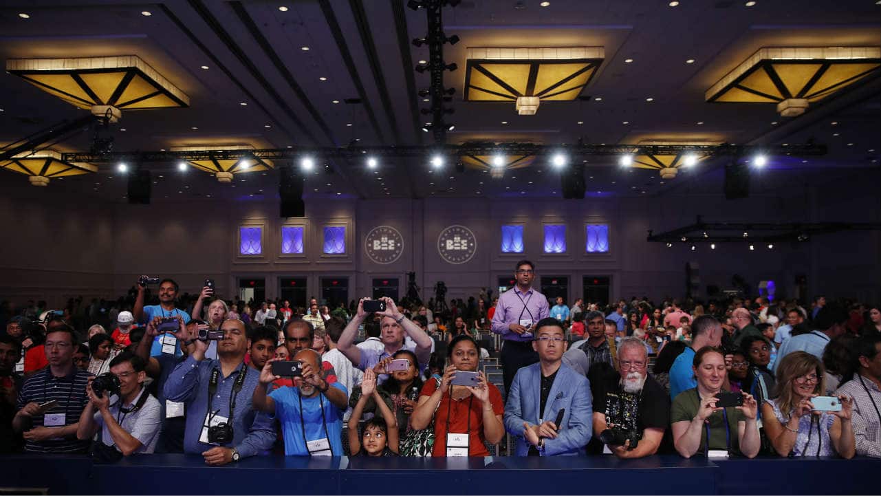 Parents and supporters gather in front of the stage to click snaps of the medal winners advancing to the final round. The 91st edition of the US annual spelling bee was held in Oxon Hill, Maryland. (Photo: AP) 