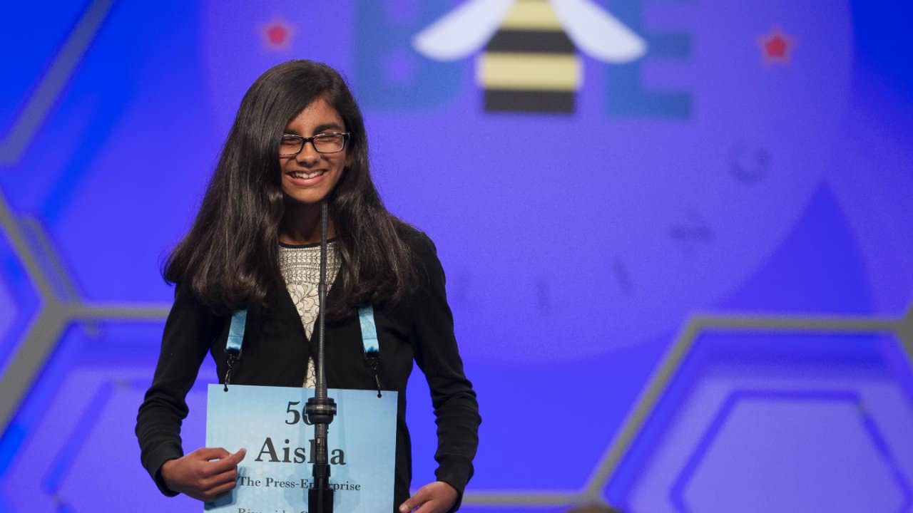 Aisha Randhawa, 12, from California spells her word correctly during the evening finals of the Scripps National Spelling Bee. (Photo: AP)