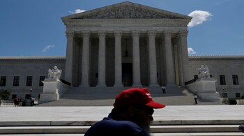 John Cullom with Patriot Picket sets up for a 2nd amendment rally outside of the U.S. Supreme Court in Washington, U.S., June 26, 2018. REUTERS/Leah Millis - RC14DE90B890