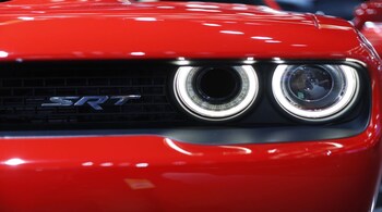 Detail view of the Dodge Challenger Hellcat front lamps while the car is displayed at the North American International Auto Show in Detroit, January 12, 2016. REUTERS/Gary Cameron - TB3EC1C1J339E