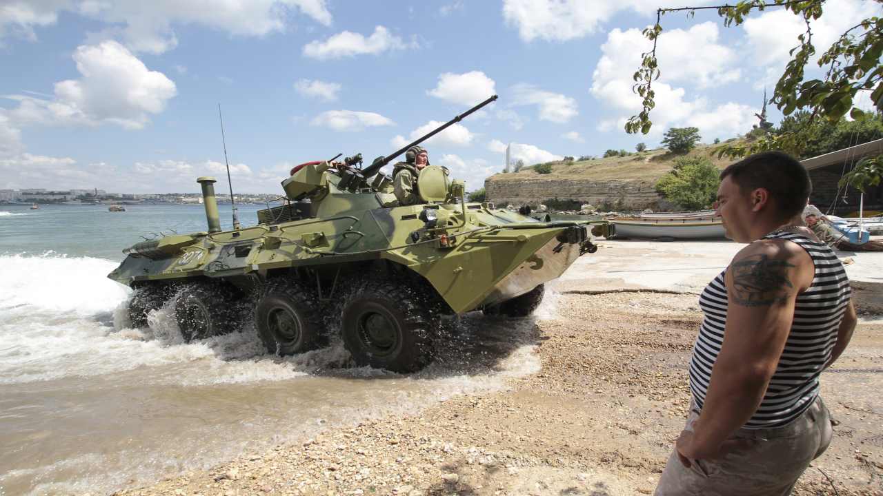A Russian armoured vehicle drives out of the water during a rehearsal for the Navy Day parade in the Black Sea port of Sevastopol, Crimea. (Image: REUTERS)