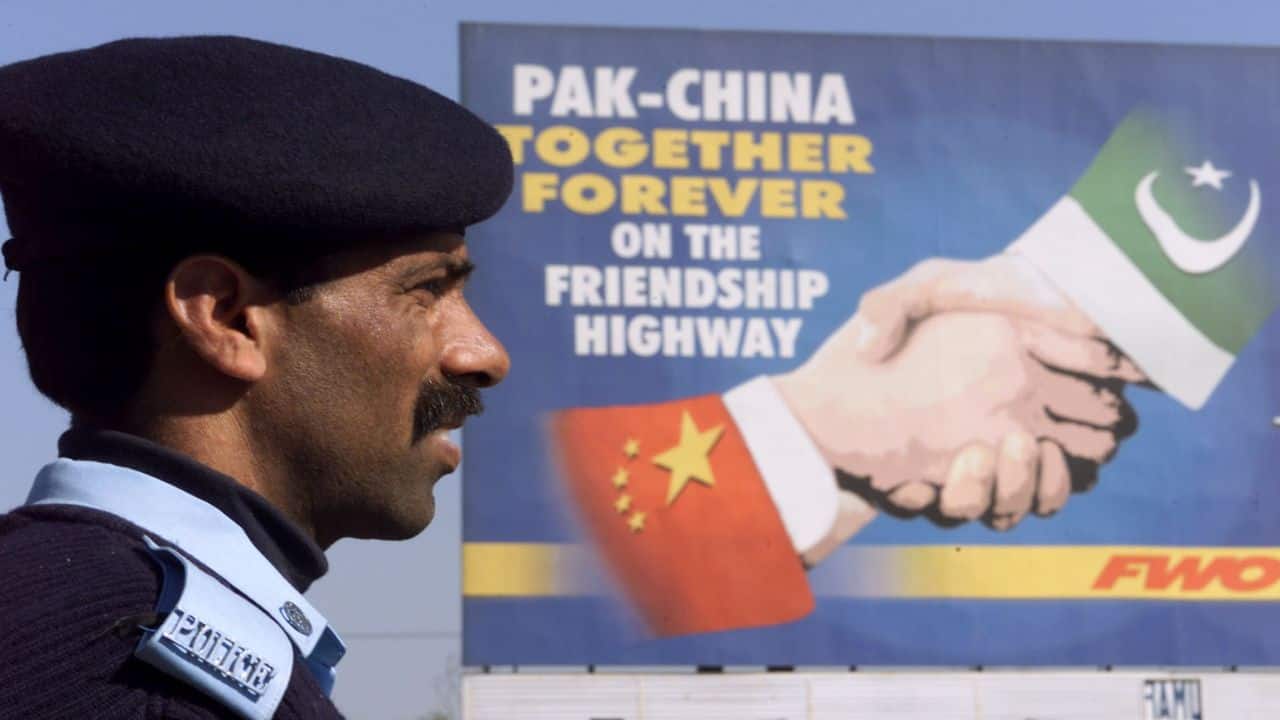 A Pakistani policeman keeps watch near a Pakistan-China friendship billboard in Islamabad (File image: Reuters)
