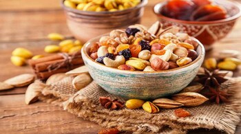 Rakhi gifts: Give your sibling a basket of assorted dry fruits and nuts, paired with treats like dark chocolate or dried berries. It is a delicious and nutritious way to enhance immunity