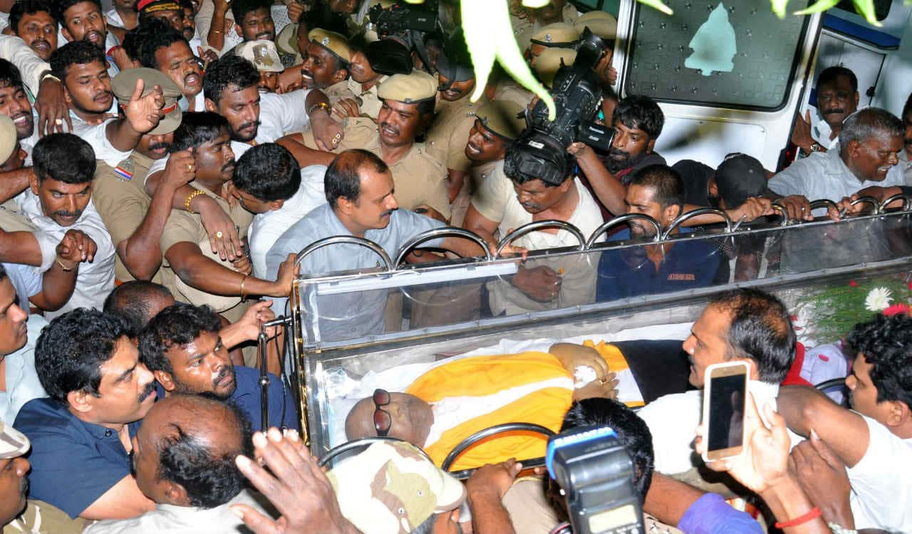 Why did the TN government deny land on Marina Beach for Karunanidhi's burial?