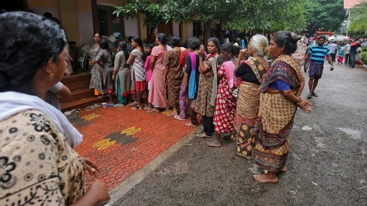 The situation in Kerala is expected to take months to normalise and years before parts of the state are reconstructed. Pictured: Flood-affected women wait in a queue to receive relief material at a camp in Chengannur. (Image: Reuters)