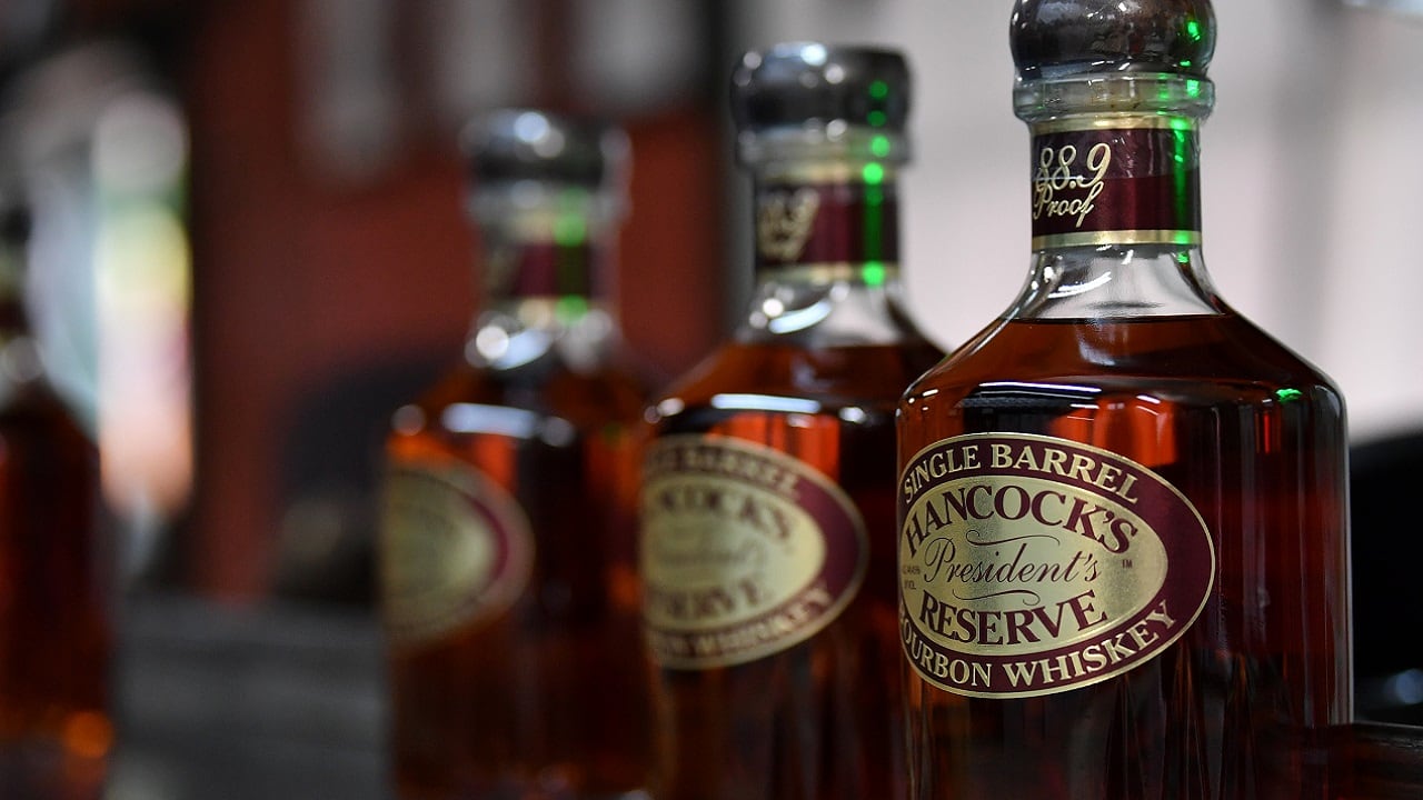 Bottles of Kentucky Bourbon Whiskey await packaging for shipment at the Buffalo Trace Distillery in Frankfort, Kentucky, U.S., June 11, 2018. REUTERS/Bryan Woolston - RC1982252CE0